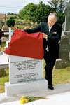 Michael Smith, Minister of Defence for Ireland
unveils the headstone on the grave of Cornelius Coughlan, V.C.
Photo by Ken Wright