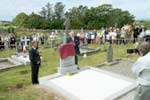 Minister of Defence Michael Smith unveils the headstone on the grave of Cornelius Coughlan, V.C.